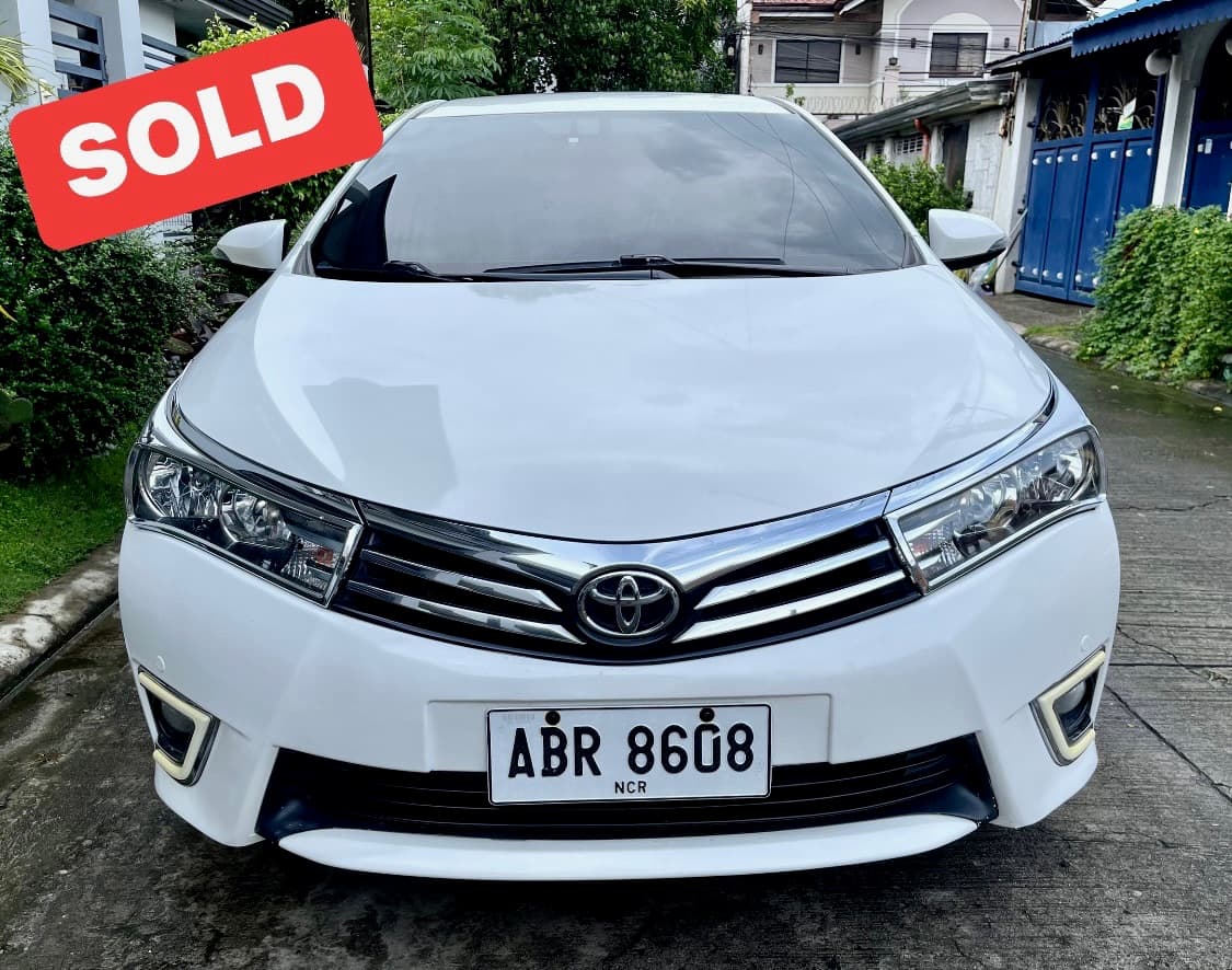 White Toyota Altis photo