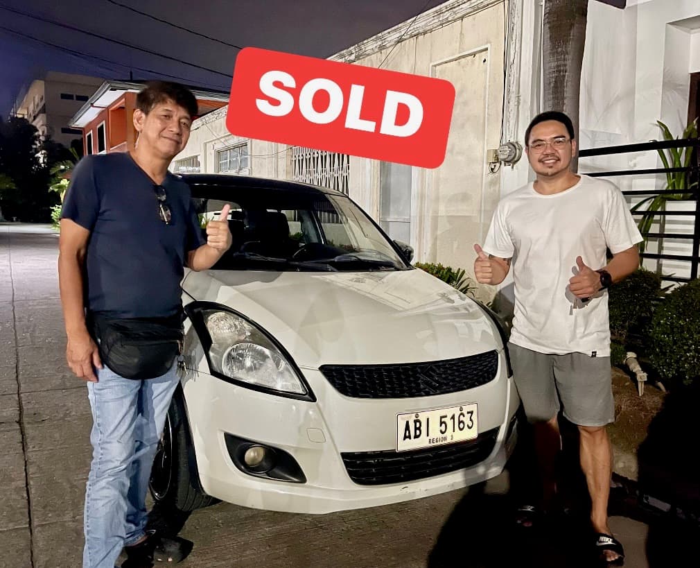White Suzuki Swift photo